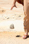 Man dropping  stone from  hand.  mercy, pardon, fo